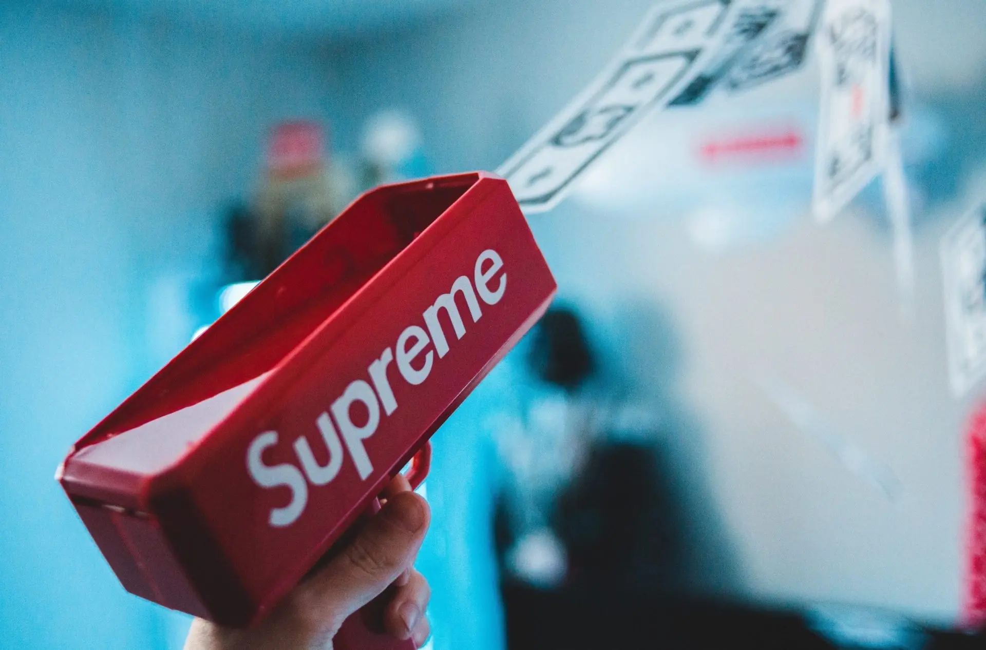Red Supreme money gun shooting fake money