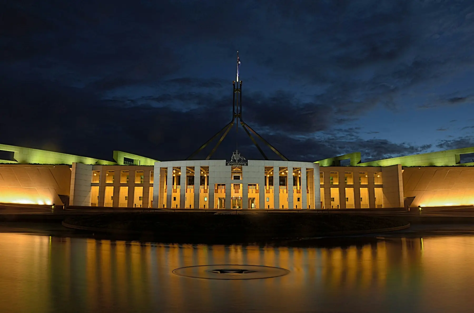 Parliament House at night with reflections