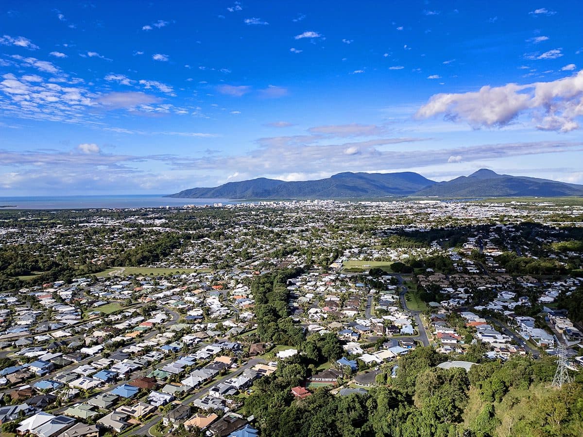 Aerial view of Cairns coastline and hills for the Cairns property market forecast