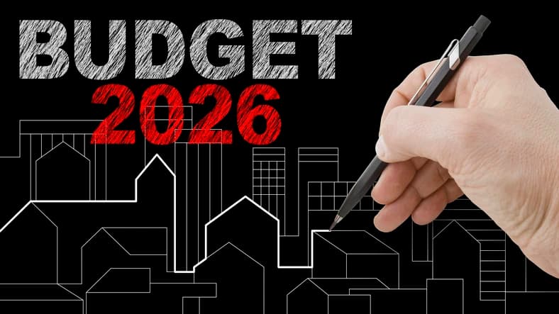 2026 Budget lettering above a hand drawing a housing skyline