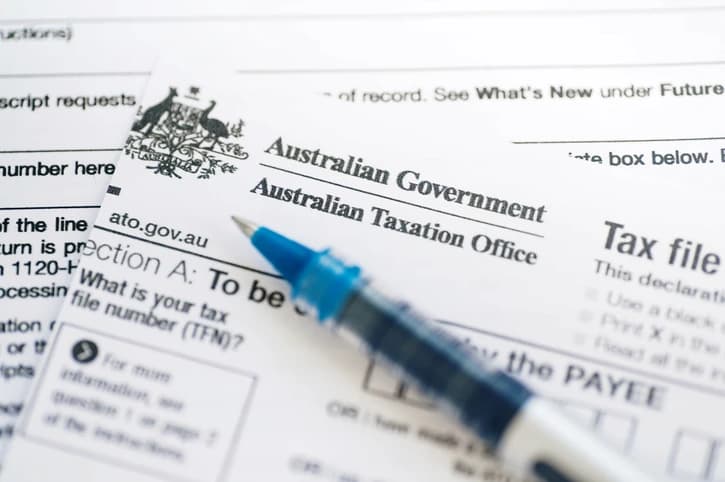 Australian Taxation Office form and pen on a desk