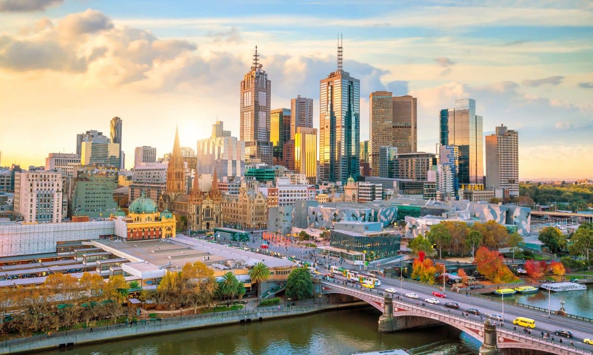 Melbourne skyline at sunset with Yarra River and bridge