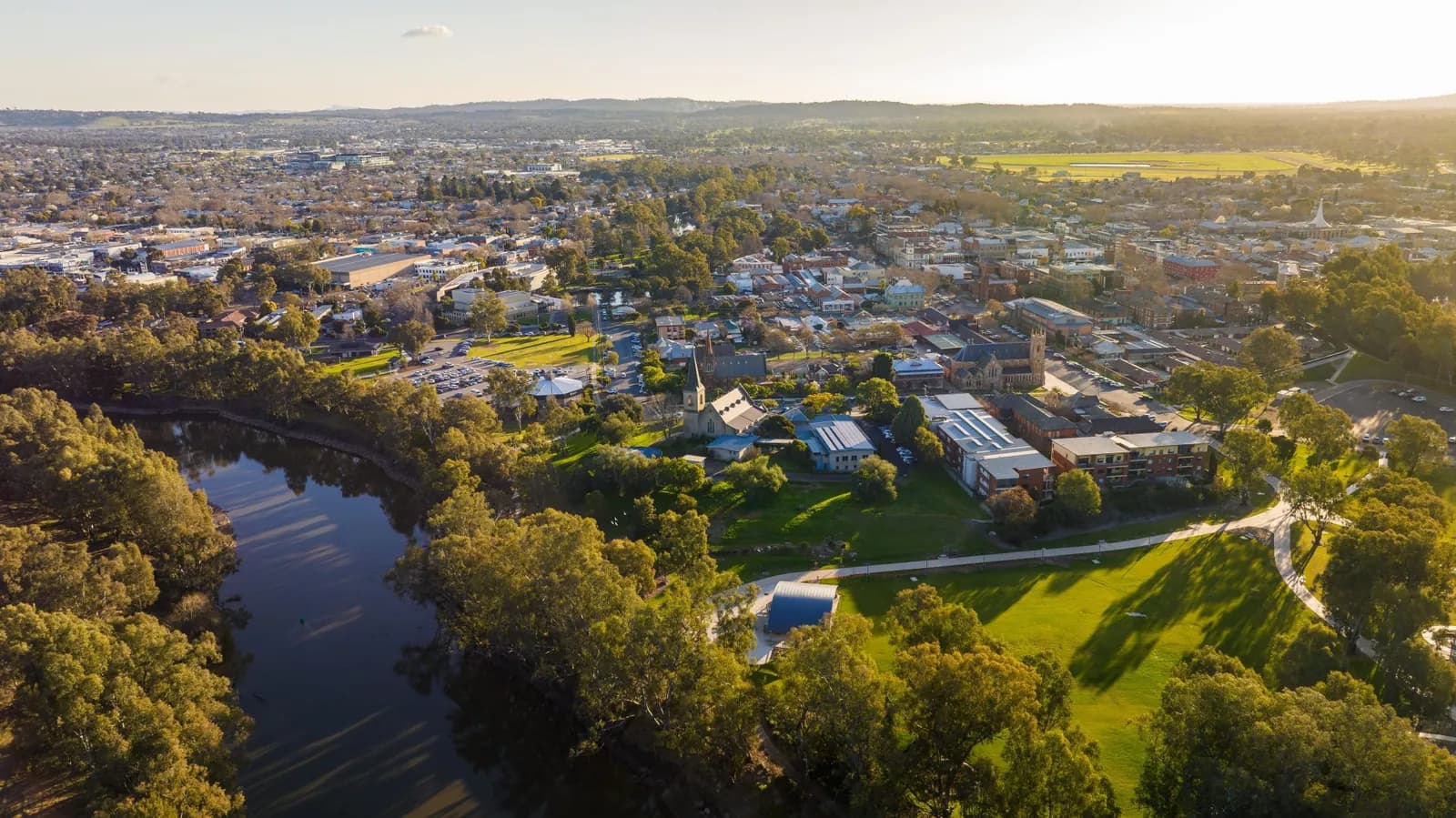 Town with river and church at sunset