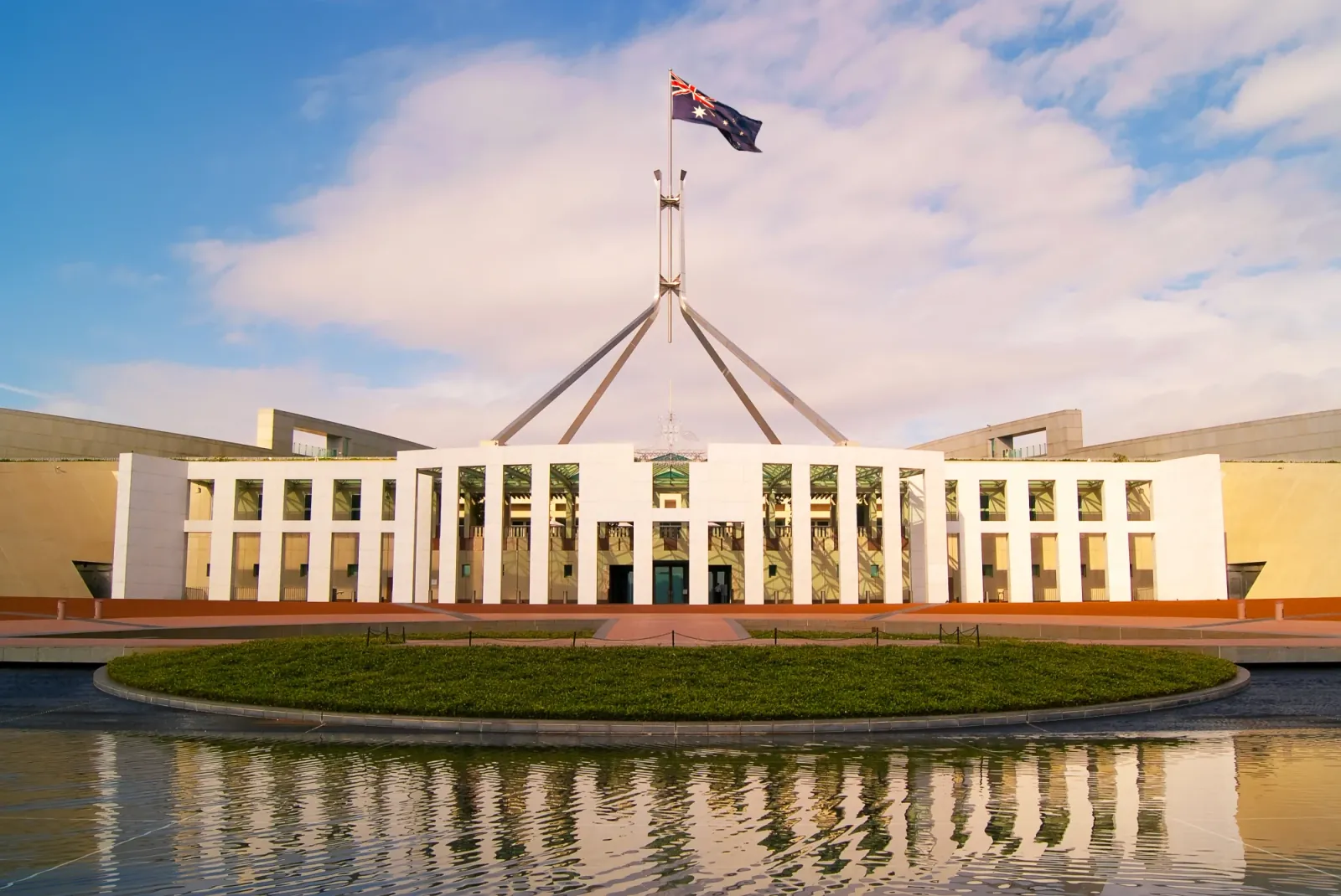 Australian Parliament House in Canberra beneath the national flag