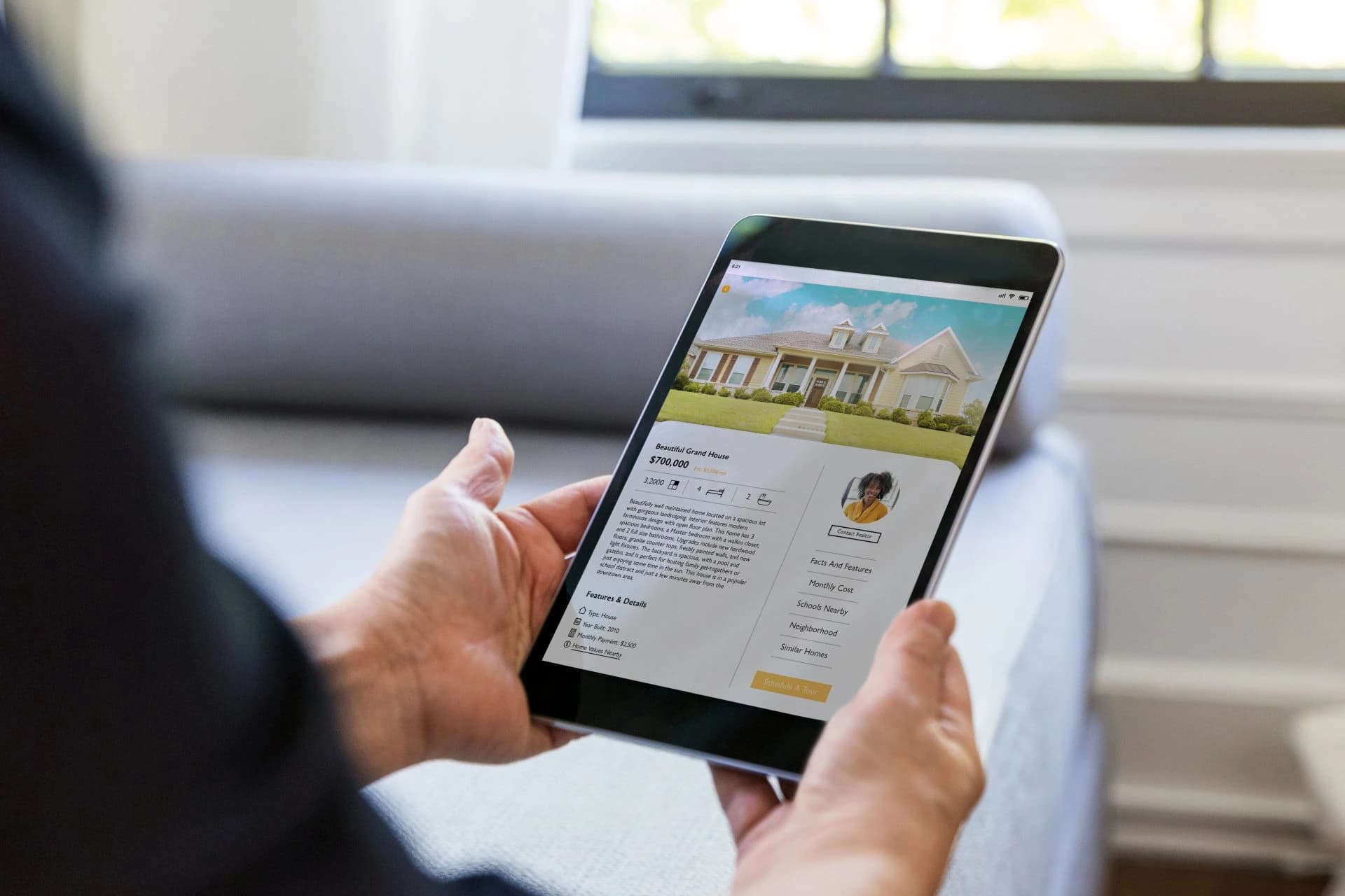 Tablet showing a house listing with details and photos.