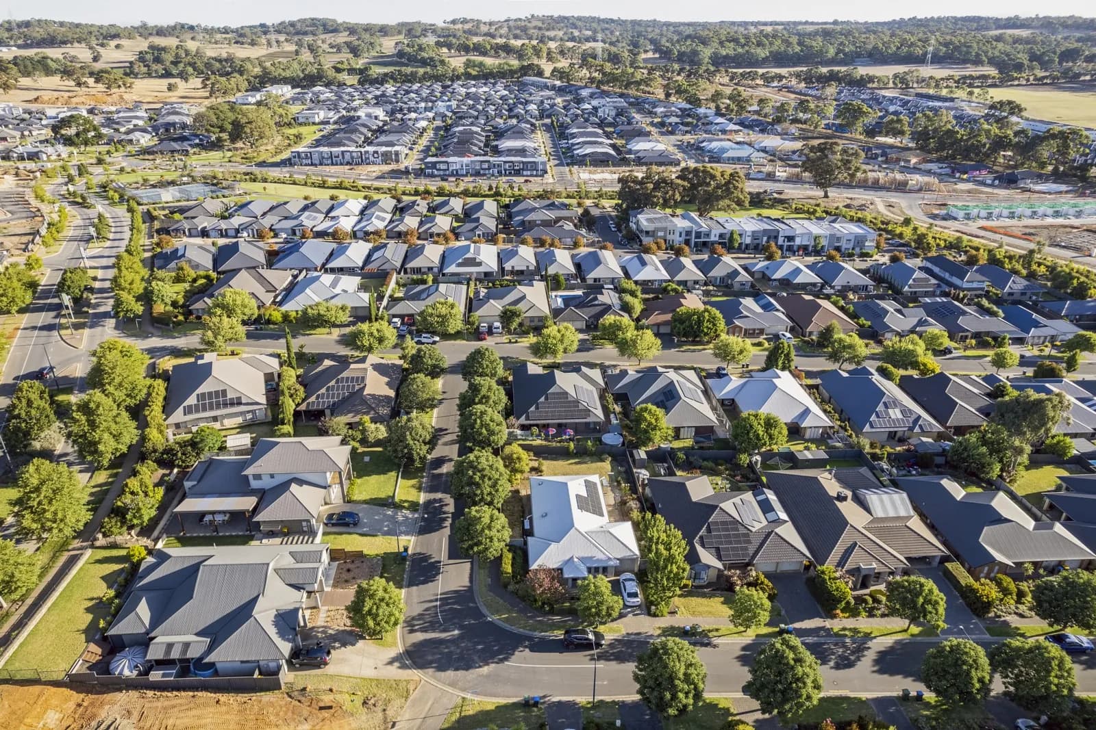 Aerial view of a middle-ring housing estate and surrounding suburbs