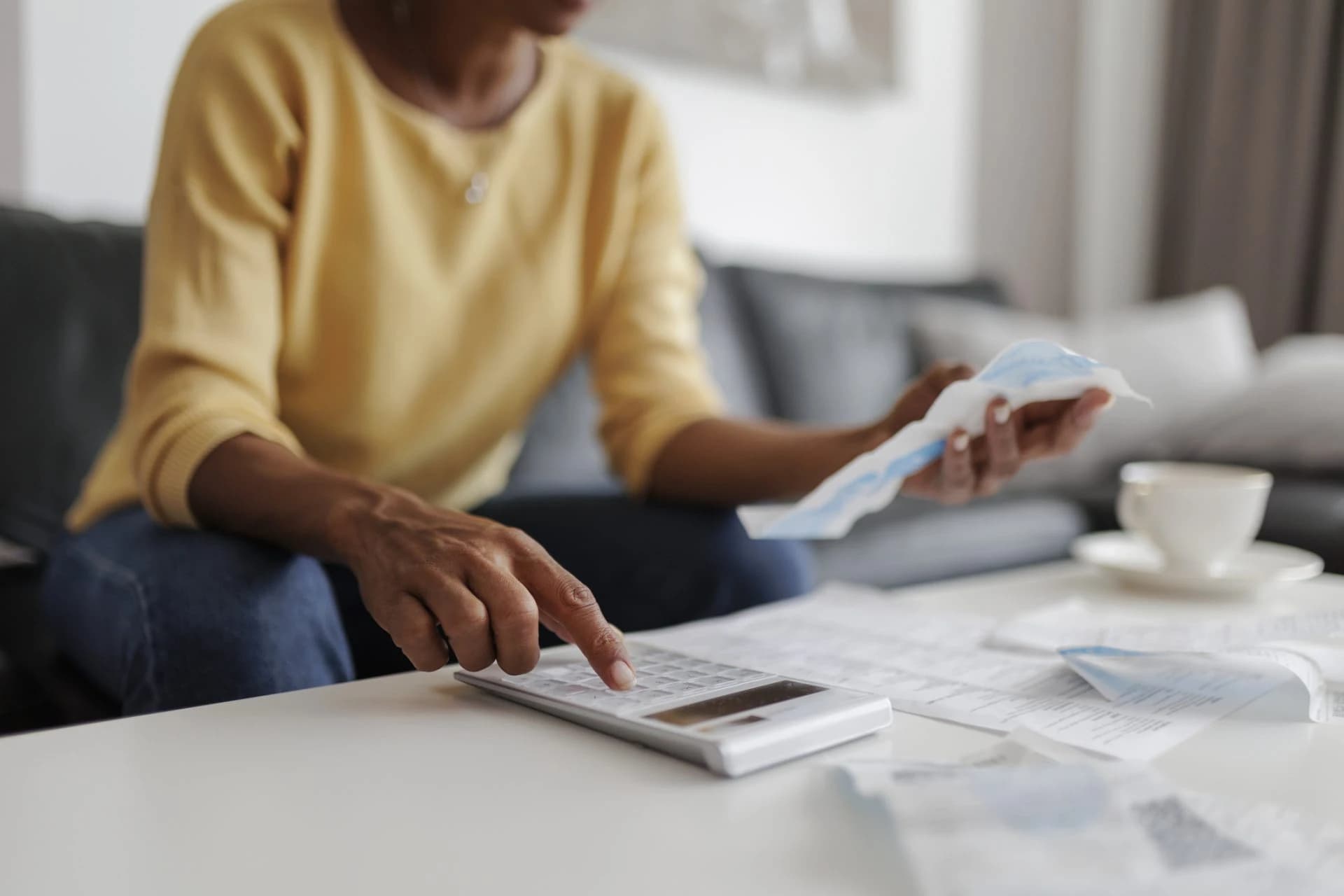 Homeowner using a calculator to compare redraw and offset accounts