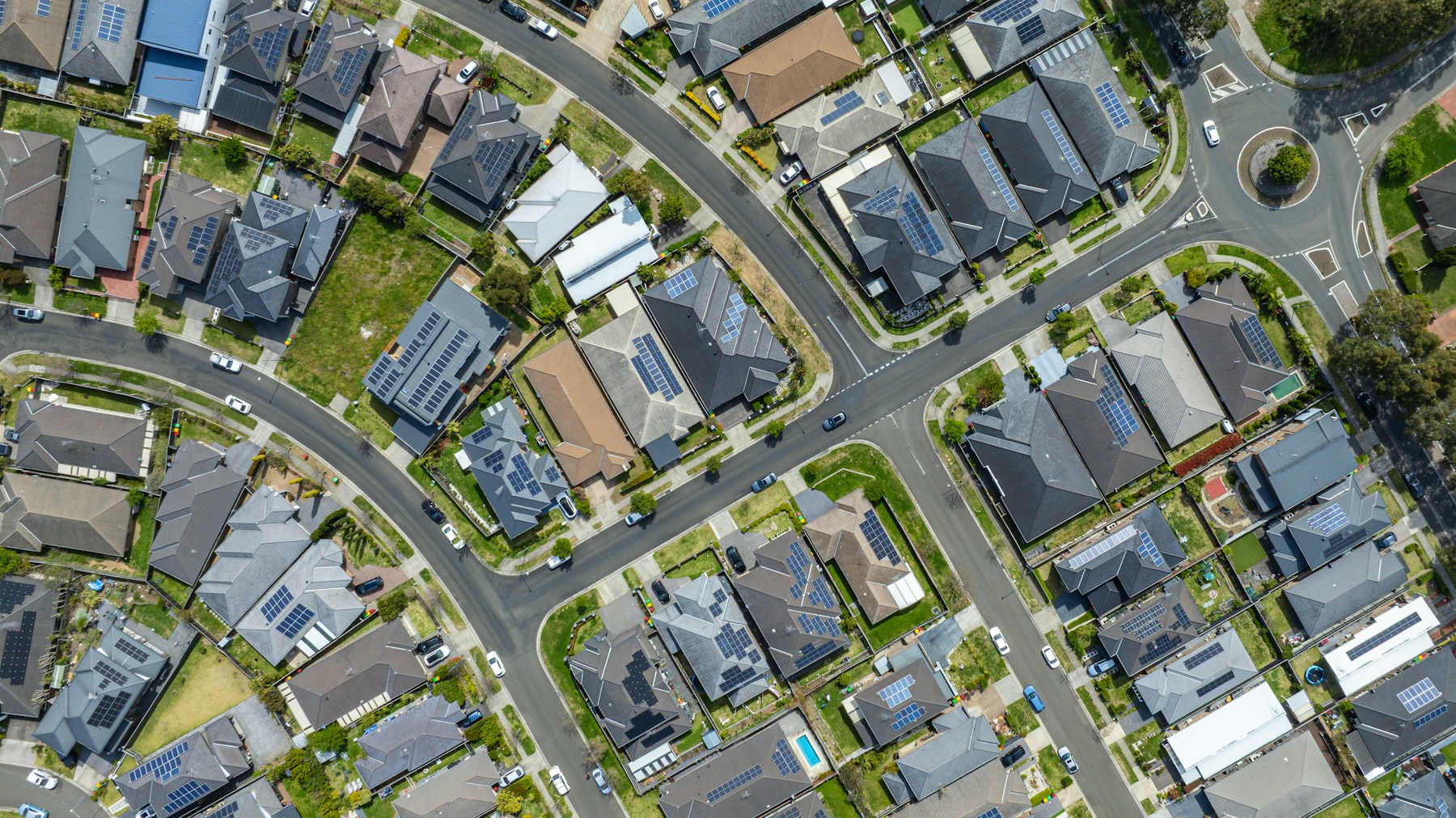 Aerial view of a suburban neighborhood with houses and streets.